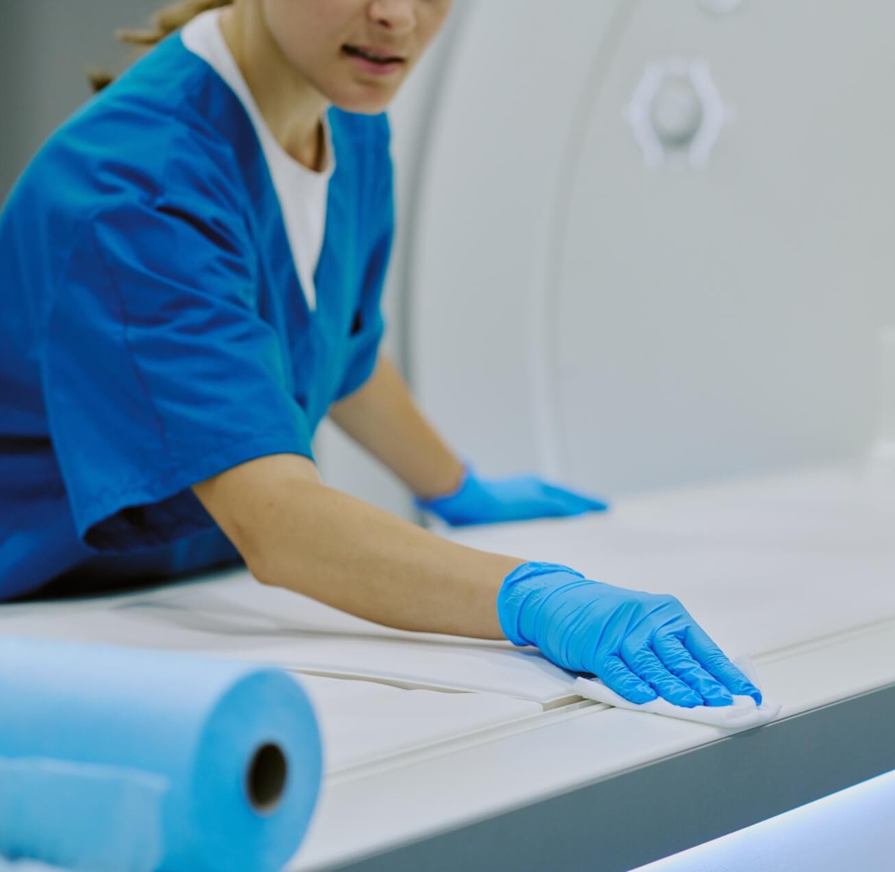 caucasian young adult woman cleaning medical square